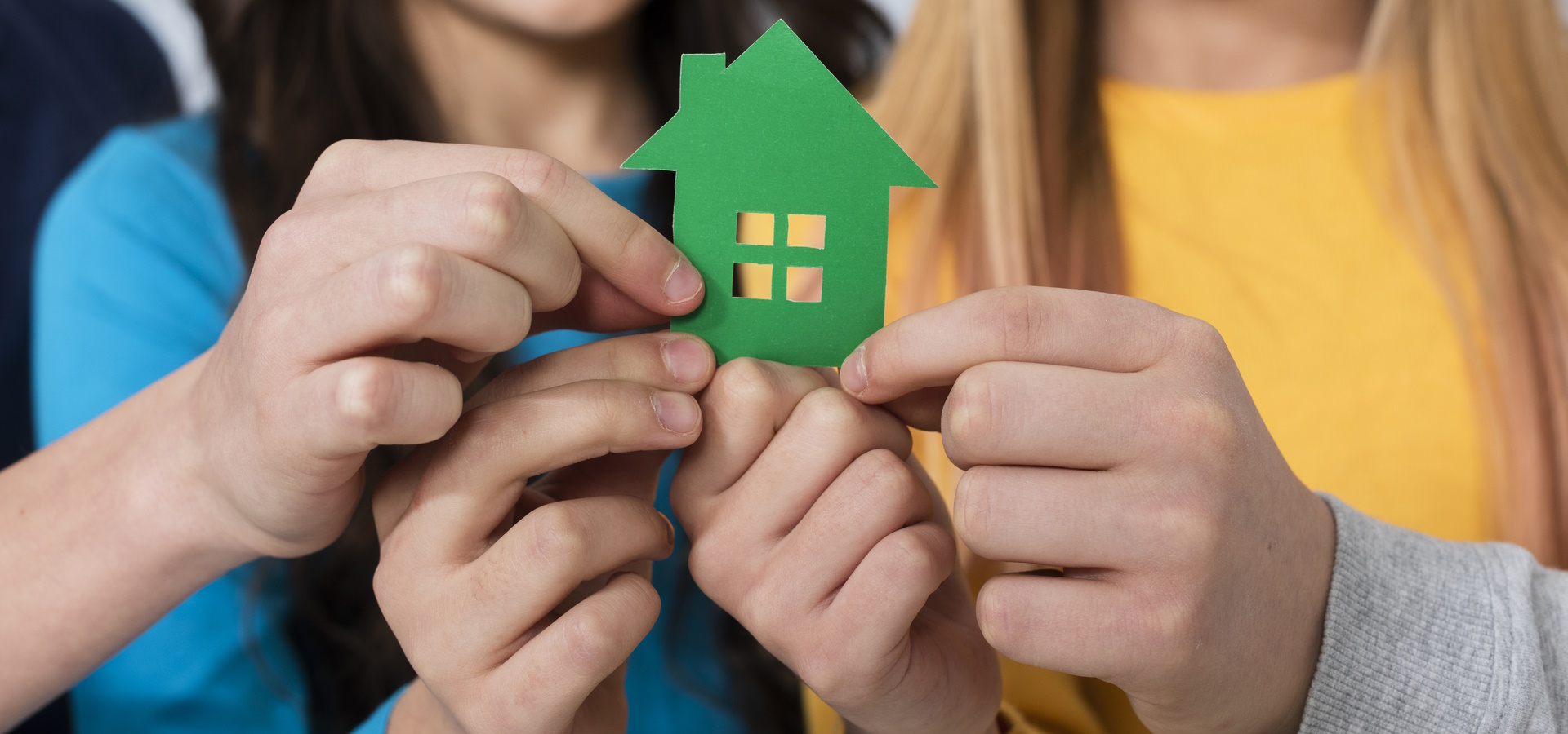 close-up-kids-holding-toy-house1